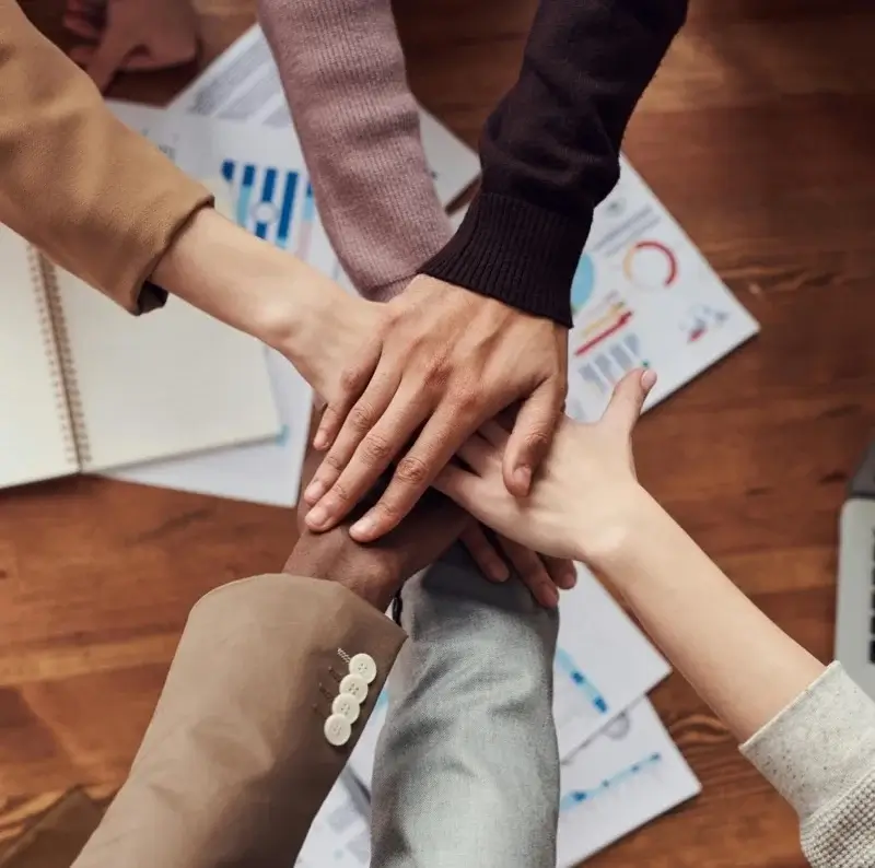 Professionals joining hands in partnership