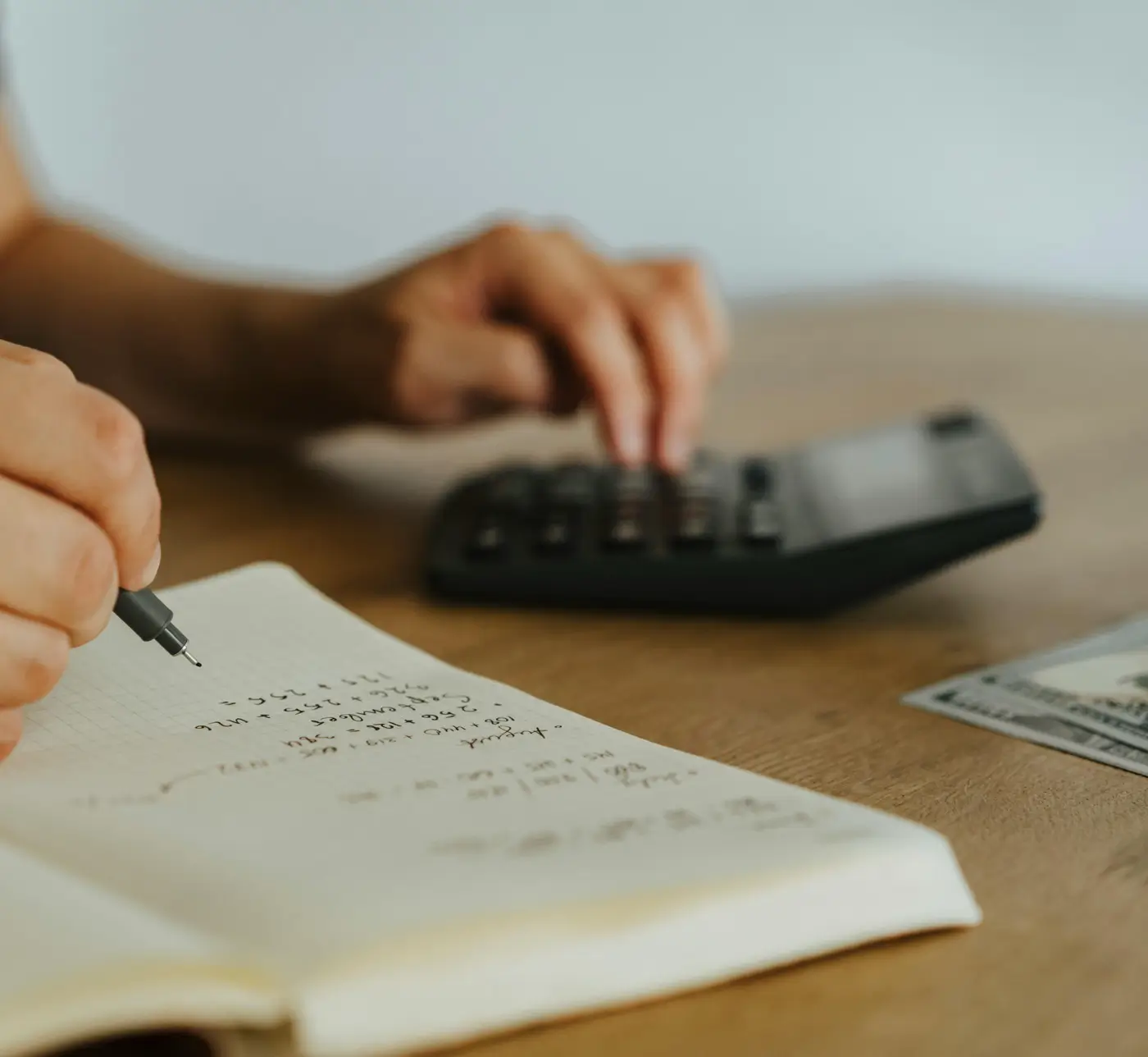 Calculator and financial documents used to review a business line of credit