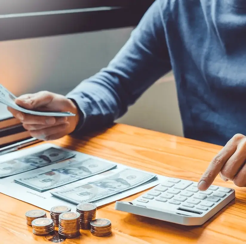 Business owner reviewing a credit card and cash-flow figures